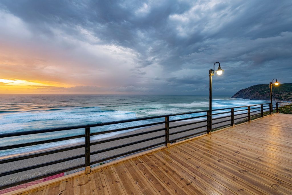 A boardwalk lamp beside the ocean