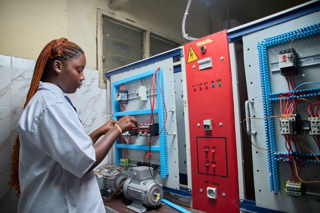 An engineer working on an electrical panel